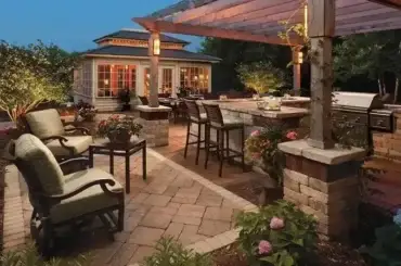 Elegant outdoor space and backyard landscaping with brick paver and patio.