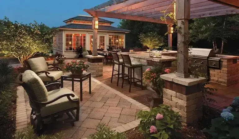Elegant outdoor space and backyard landscaping with brick paver and patio.
