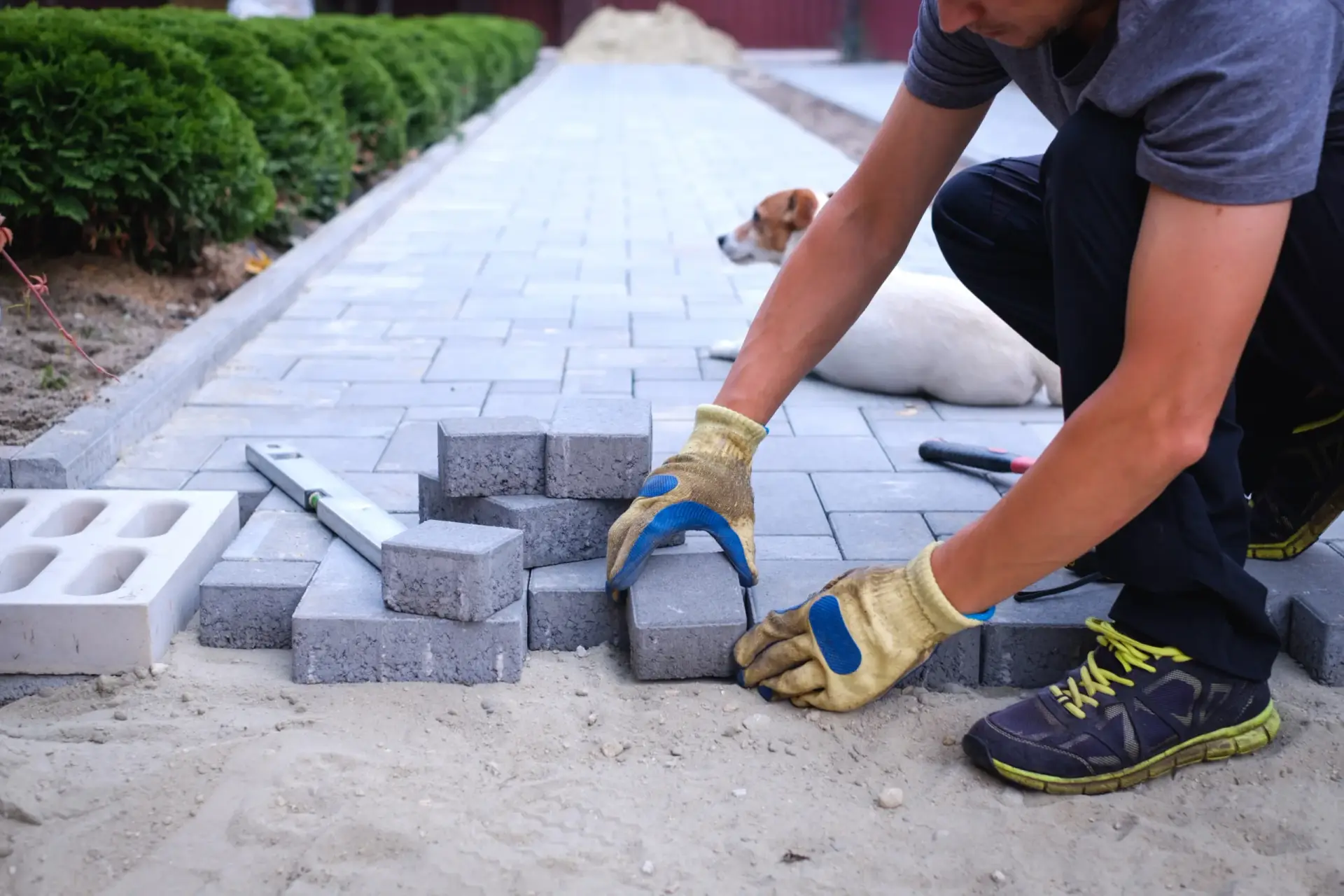 Construction-worker-brick-walkway-landscaping