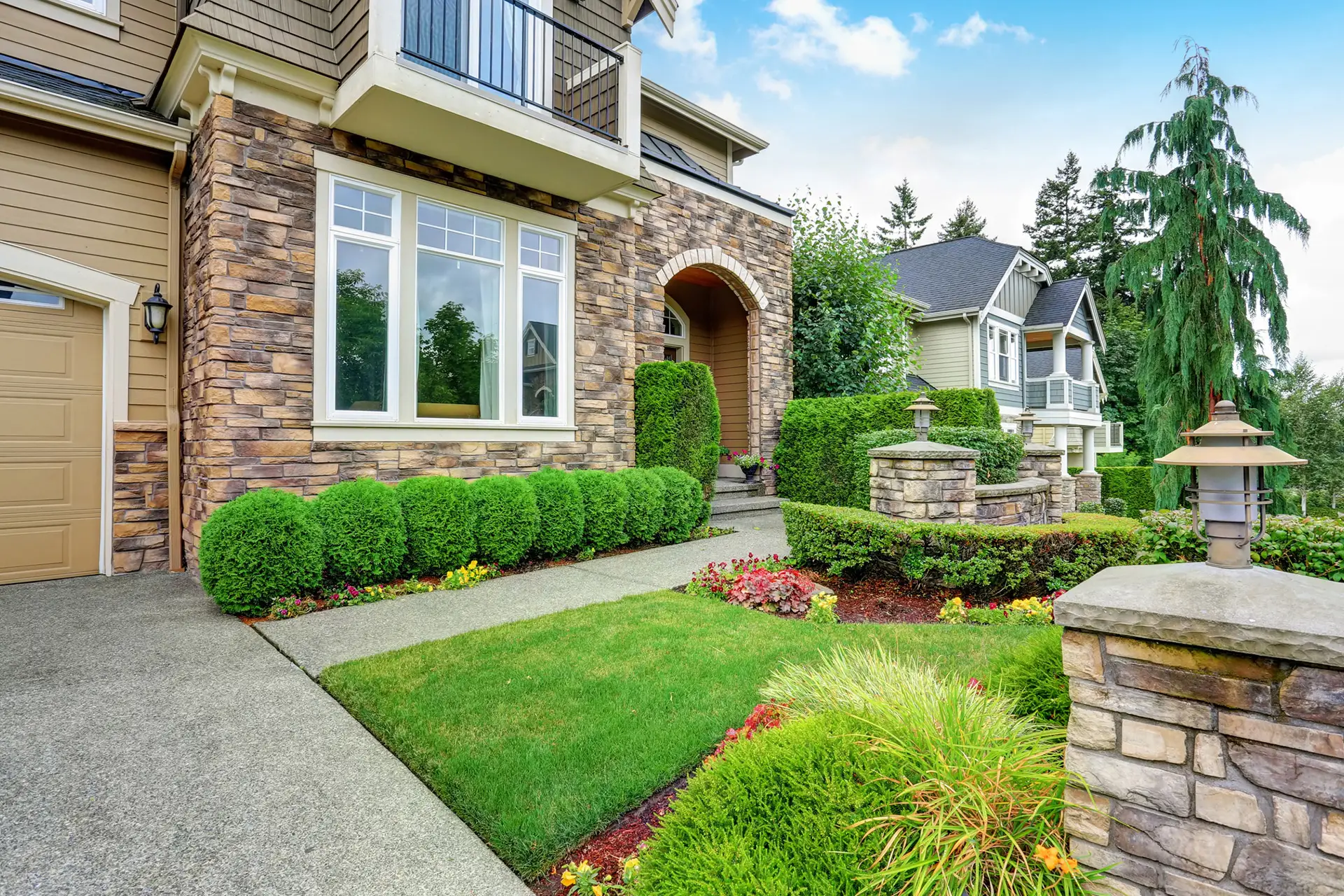 a lush landscape design featuring a variety of plants and trees, with a focus on greenery and natural beauty to enhance outdoor spaces