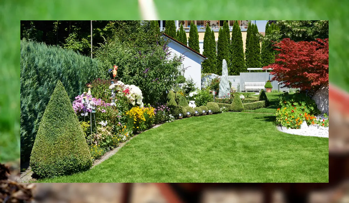 A beautifully designed front yard showcasing low maintenance landscaping in Bolingbrook, featuring vibrant plants, neatly trimmed hedges, and a well-maintained lawn.